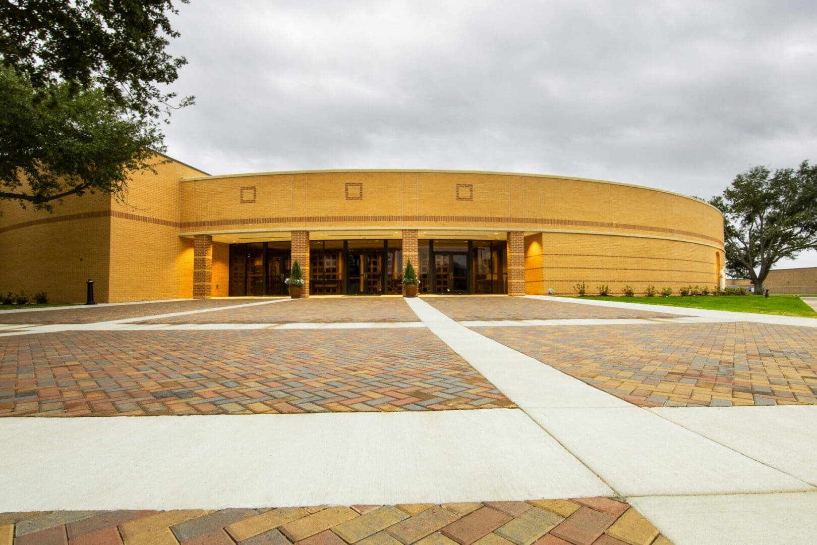 Modern brick building with curved architecture.