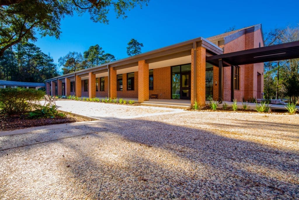 Modern building with large windows and columns.